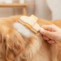 FurVeylo Pet Grooming Comb being used to groom a fluffy dog
