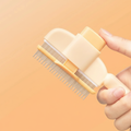 FurVeylo Pet Grooming Comb macro detail of steel teeth and release button